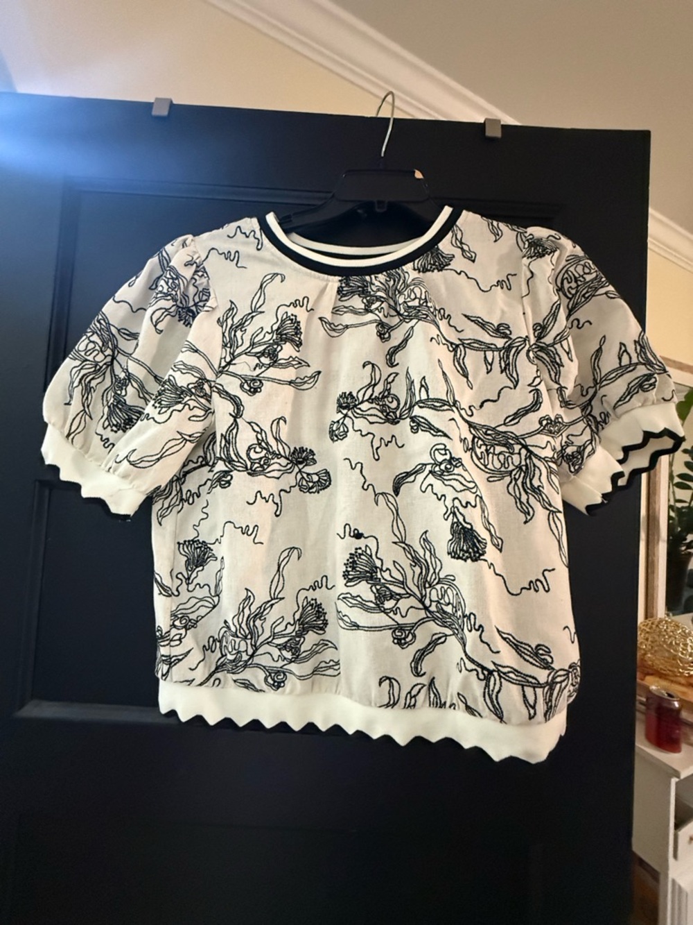 White Short Sleeve Floral Knit Top with Black Outline by Voy.